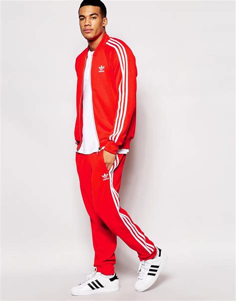 fake adidas tracksuit red white|red adidas jogging suit.